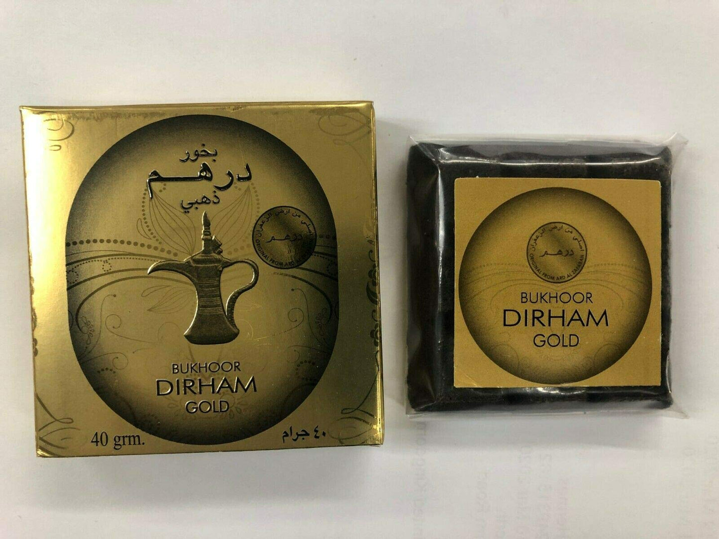 Packaging of Bukhoor Dirham Gold with branding and product name visible, predominantly gold colored from Malik Foodstore
