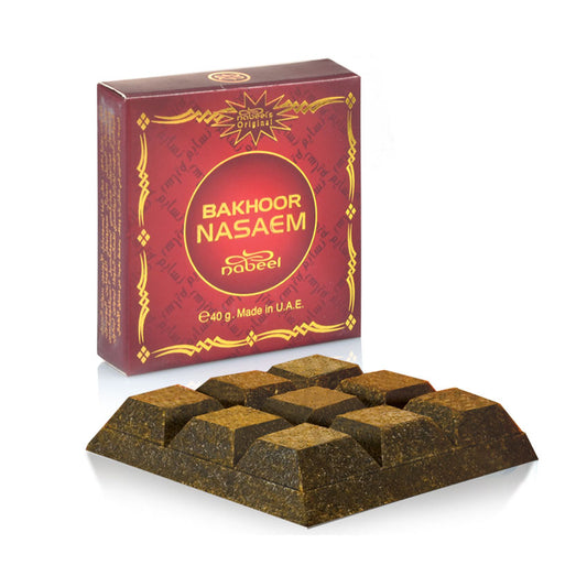 A packaged Bakhoor Nasaem product, with the brand name visible on the red packaging, indicating it is a fragrant incense made in UAE from Malik Foodstore
